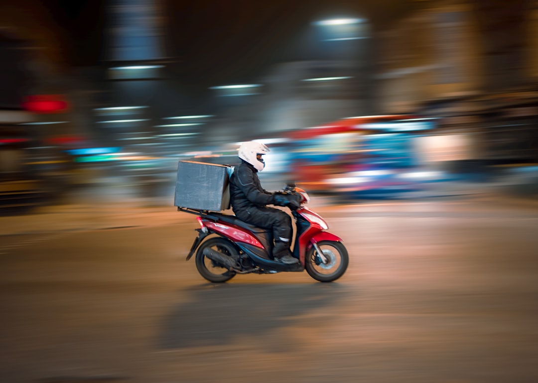 Blaze Pizza's electric delivery vehicle charging at a station